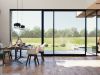 open sliding patio doors in modern home with garden in view