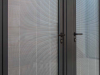 large doors with blinded glass installed