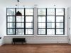 Two large windows in an empty studio like room