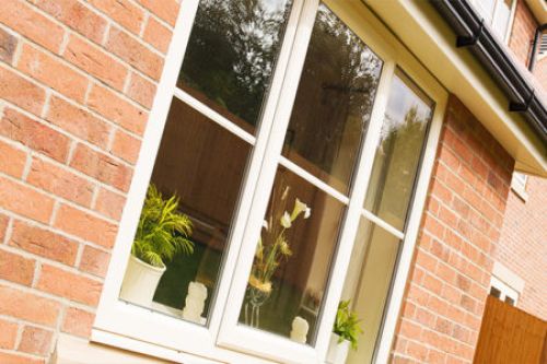 Front house windows with plant pots in view