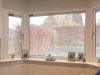 living room with blinded glass windows installed