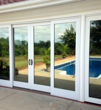 patio doors with mirrored glass reflecting pool view