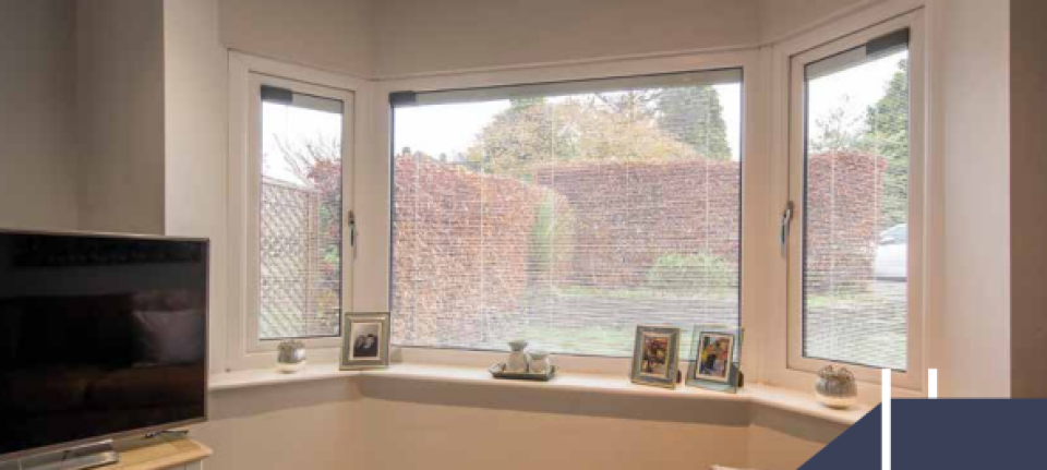 living room with blinded glass windows installed