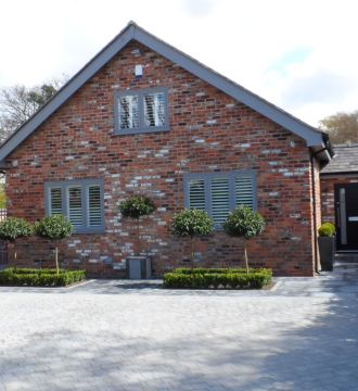 home with all windows in view including door and driveway