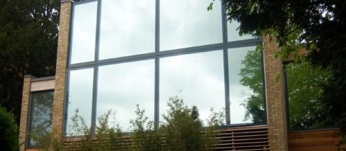 modern house windows with mirrored glass installed