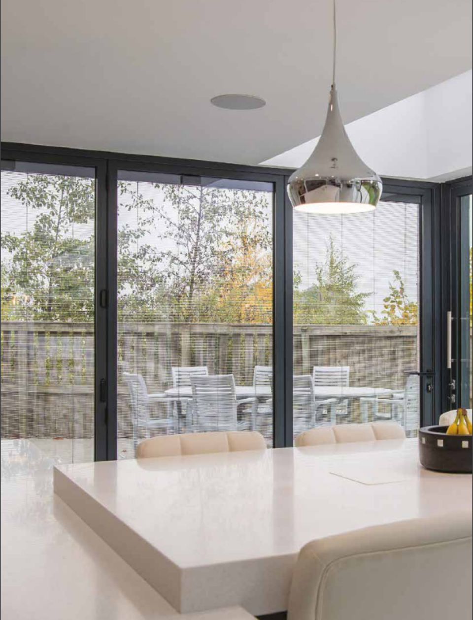 modern kitchen with blinded glass windows installed