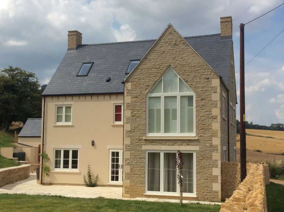 home wide shot with all windows in view including door and driveway