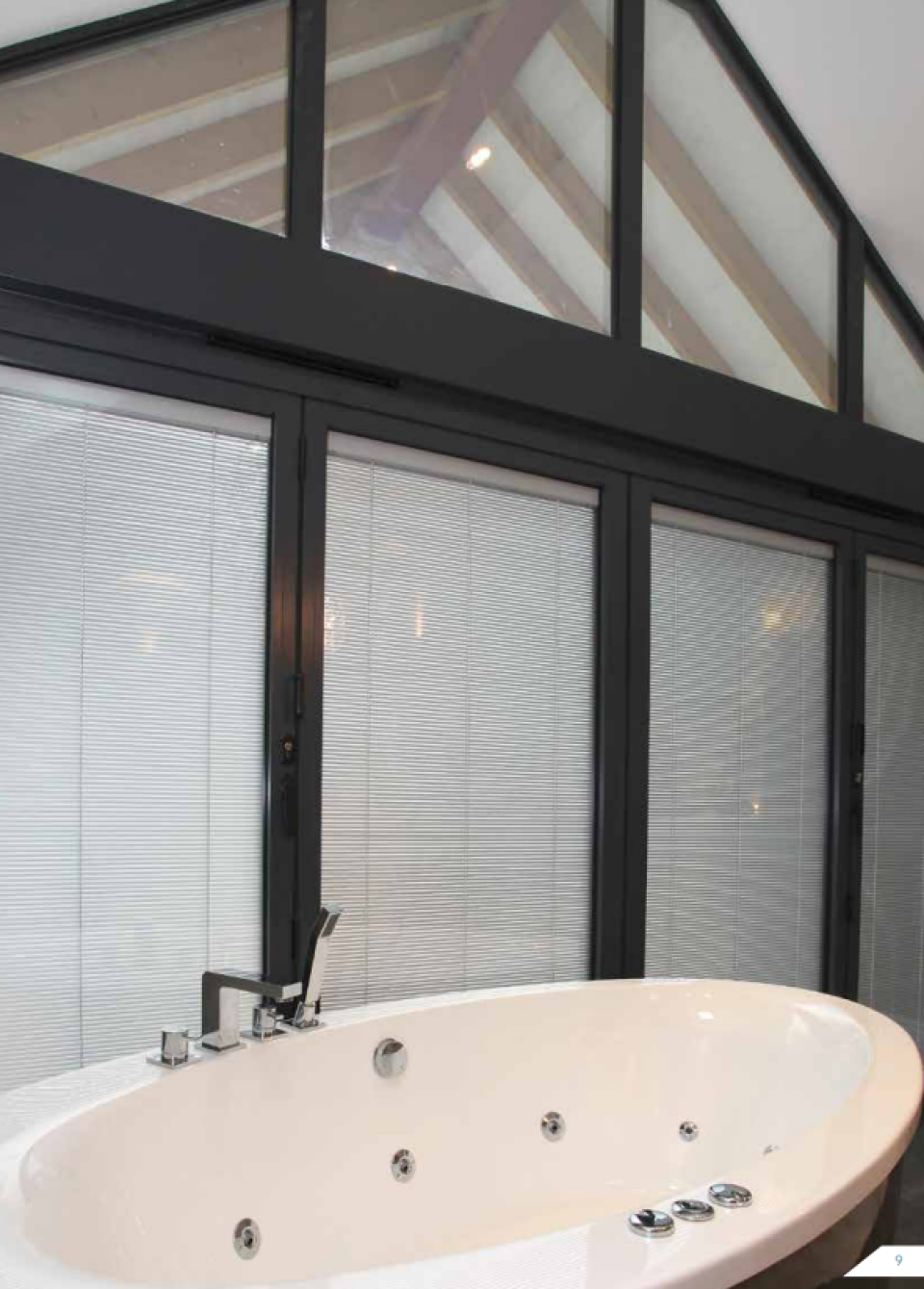 bathroom with large blinded glass windows 